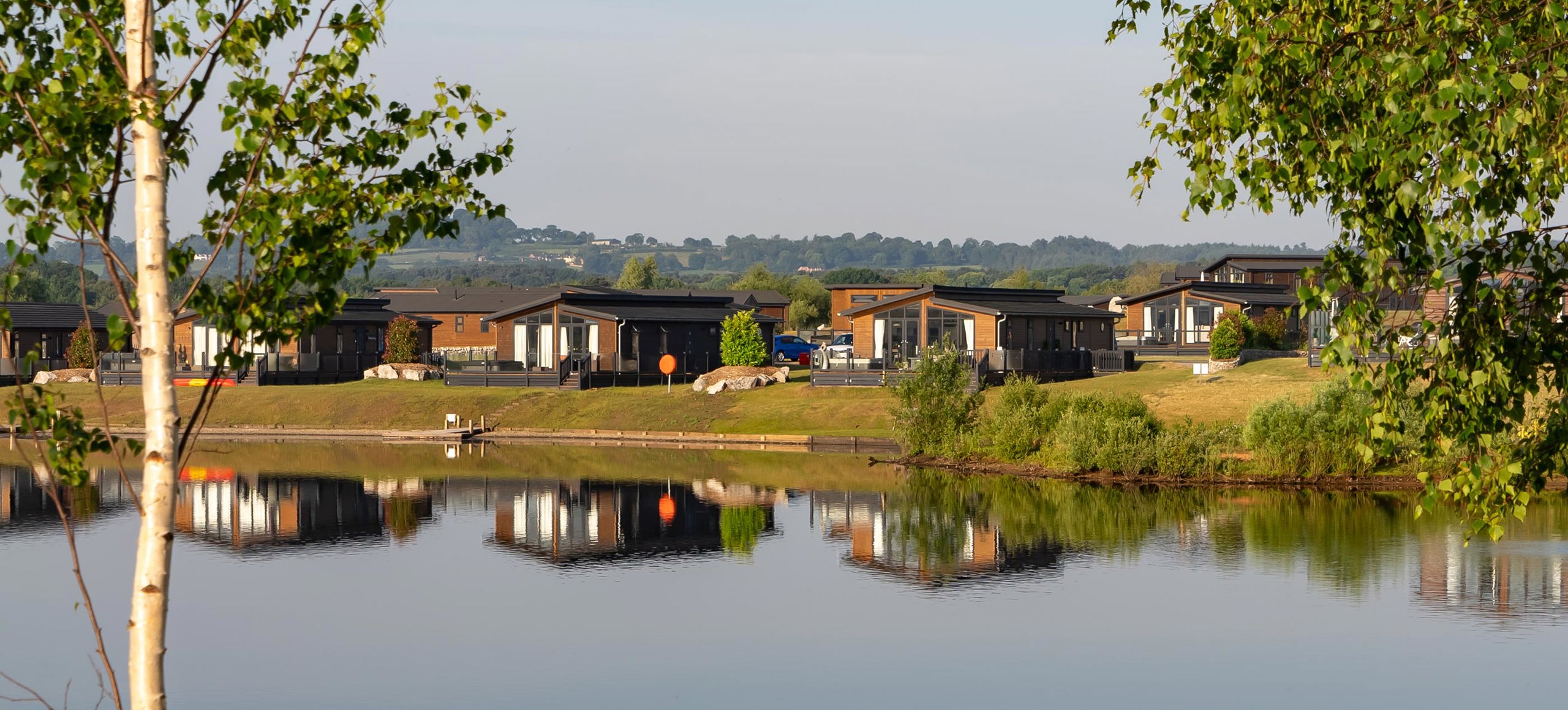 Delamere Lake And Trees Reflecting