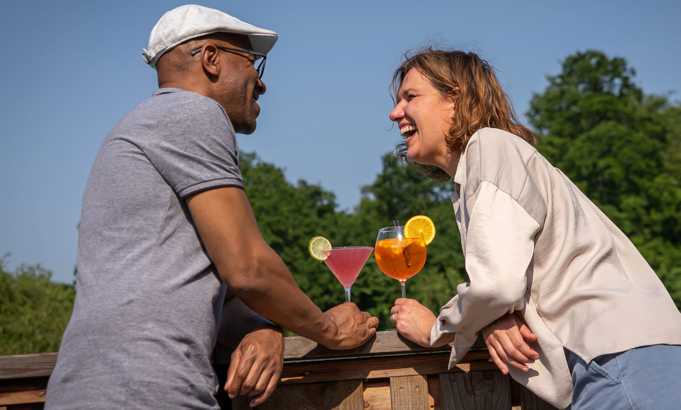 Couple enjoying drinks outside at Finlake Resort and Spa