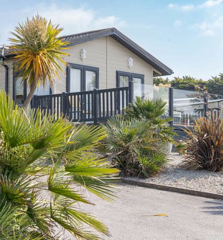 Praa Sands Lodge Exterior with Palm Trees