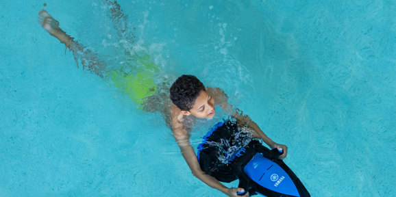 Young boy on seascooter at Finlake swimming pool