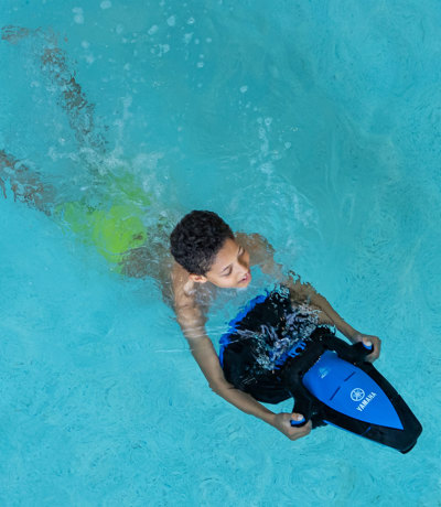 Young boy on seascooter at Finlake swimming pool
