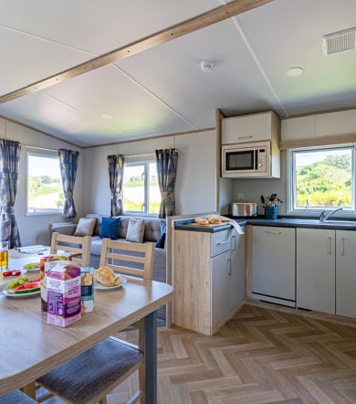 Carnaby Ashdale, dining table and kitchen at Praa Sands