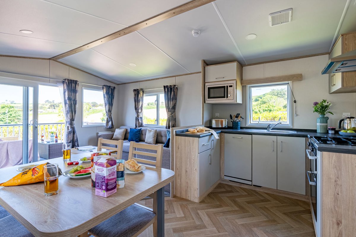 Carnaby Ashdale, dining table and kitchen at Praa Sands