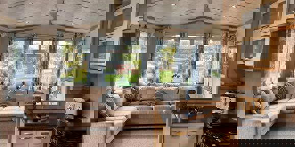 Carnaby Casablanca, windows and corner sofa in living area at Dartmoor View