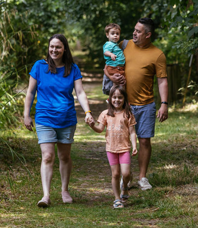 Brokerswood Family Walking Through The Woodland