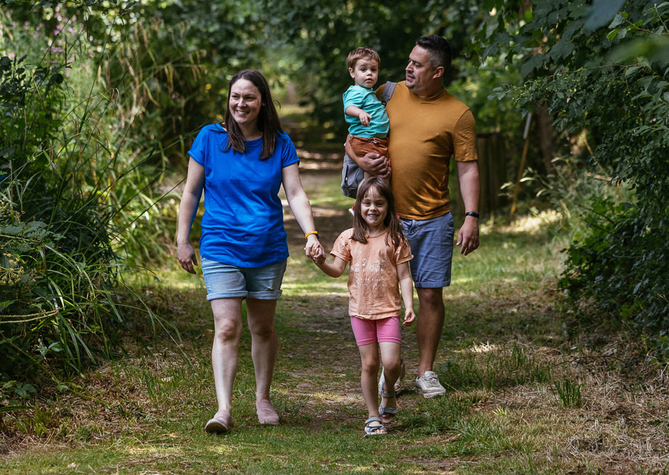 Brokerswood Family Walking Through The Woodland