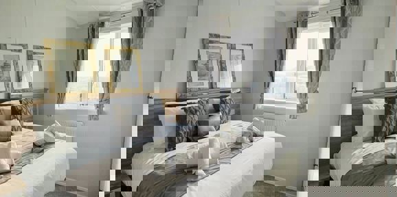 Willerby Pinehurst, master bedroom with pictures at Delamere