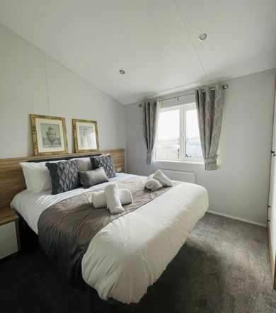 Willerby Pinehurst, master bedroom with pictures at Delamere