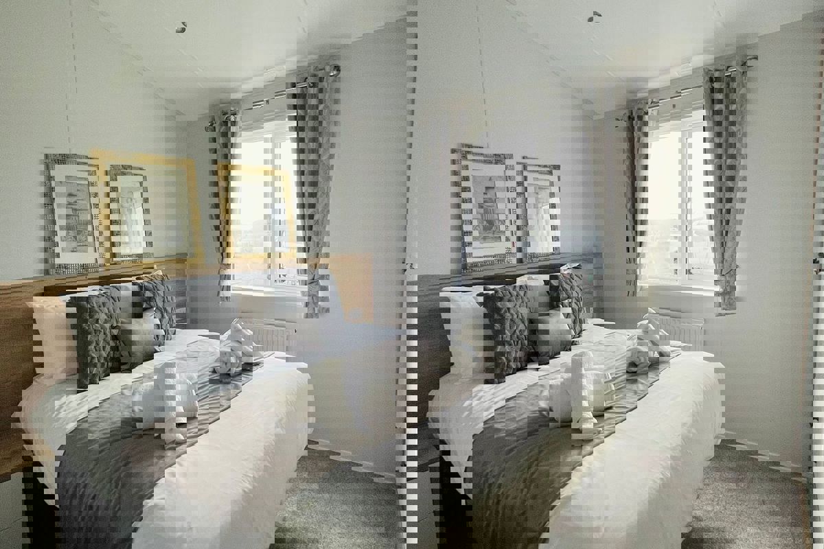 Willerby Pinehurst, master bedroom with pictures at Delamere