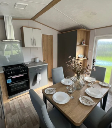 Carnaby Silverdale, dining room table at Talyfan