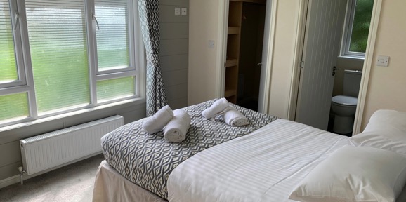 Buckland Lodge, master bedroom with window at Finlake