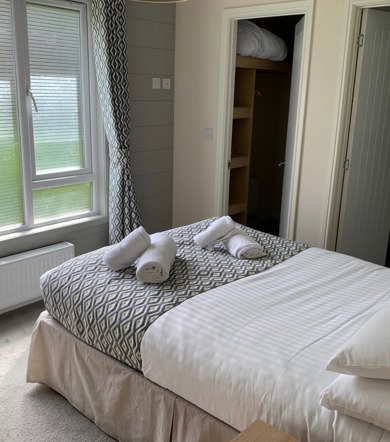Buckland Lodge, master bedroom with window at Finlake