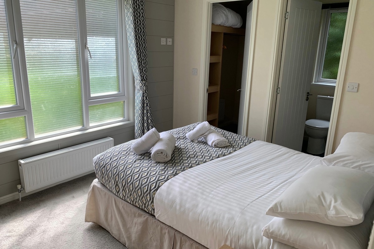 Buckland Lodge, master bedroom with window at Finlake