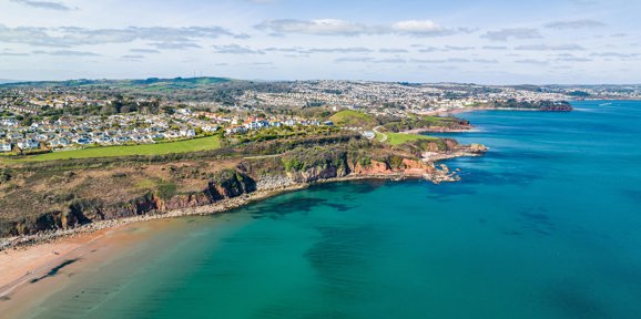 Aerial shot of Armchair Cove And Broadsands Beach near Devon Hills