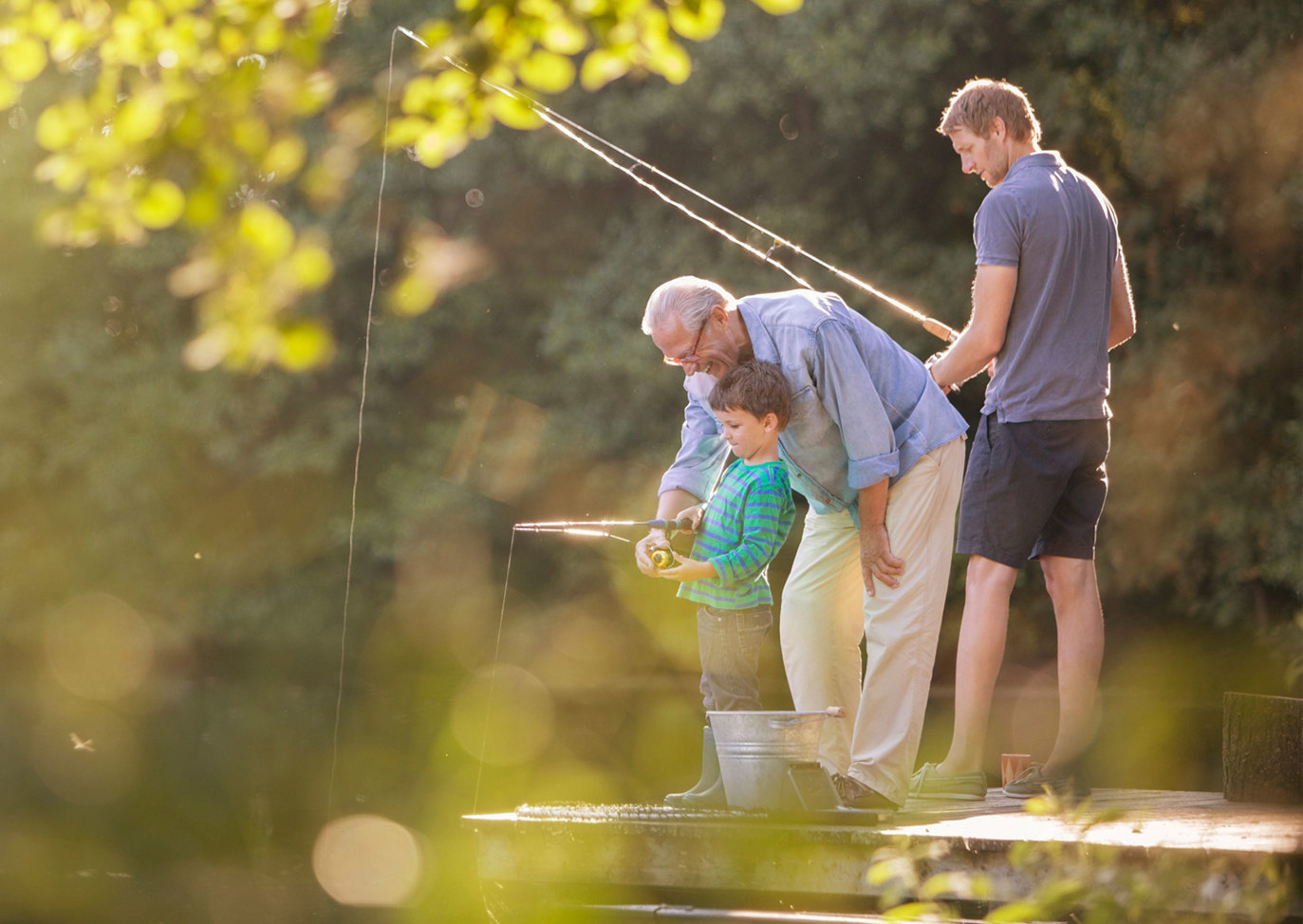 Family fishing at Finlake Holiday Park river
