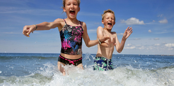 Crugan Local Area Kids Jumping Into The Sea