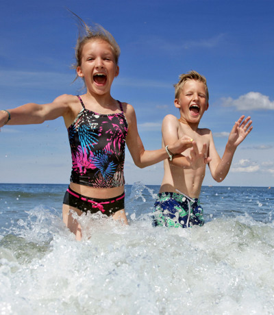 Crugan Local Area Kids Jumping Into The Sea