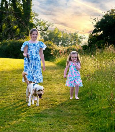 Devon Hills Children Walking A Dog