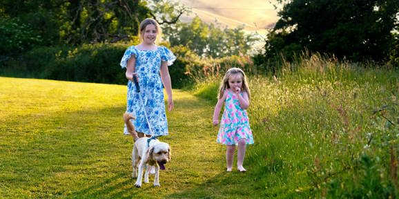 Devon Hills Children Walking A Dog