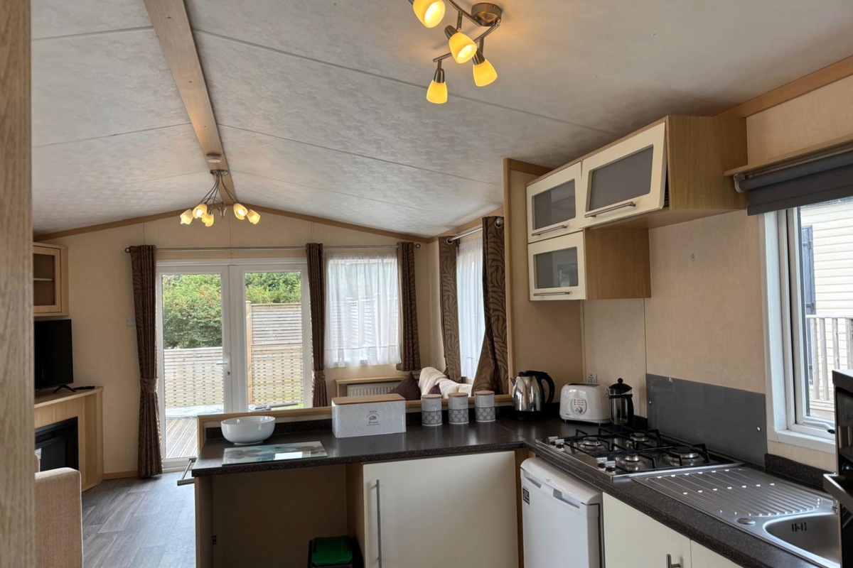 Carnaby Melrose, patio doors in living area at Dartmoor View