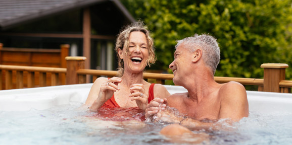 Finlake Couple Laughing In A Hot Tub