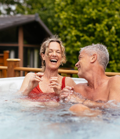 Finlake Couple Laughing In A Hot Tub