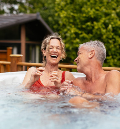 Finlake Couple Laughing In A Hot Tub