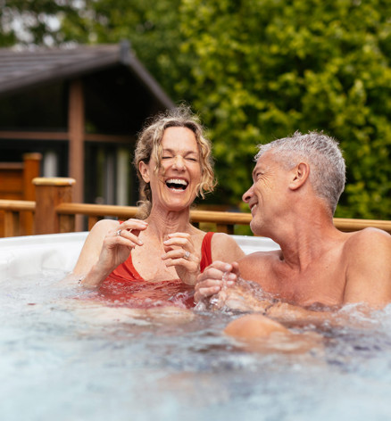 Finlake Couple Laughing In A Hot Tub