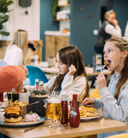 Devon Hills Family Eating Burgers At The Hive