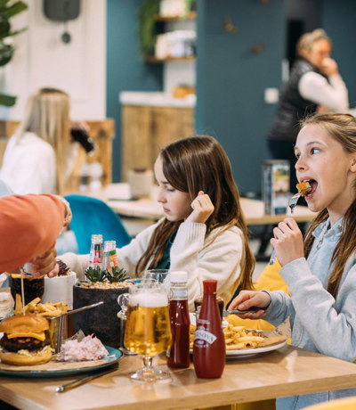 Devon Hills Family Eating Burgers At The Hive