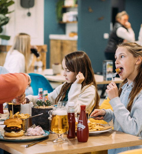 Devon Hills Family Eating Burgers At The Hive