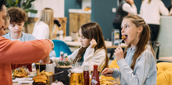 Devon Hills Family Eating Burgers At The Hive