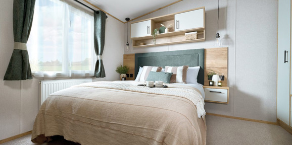 ABI St David, double bedroom with green curtains at Praa Sands