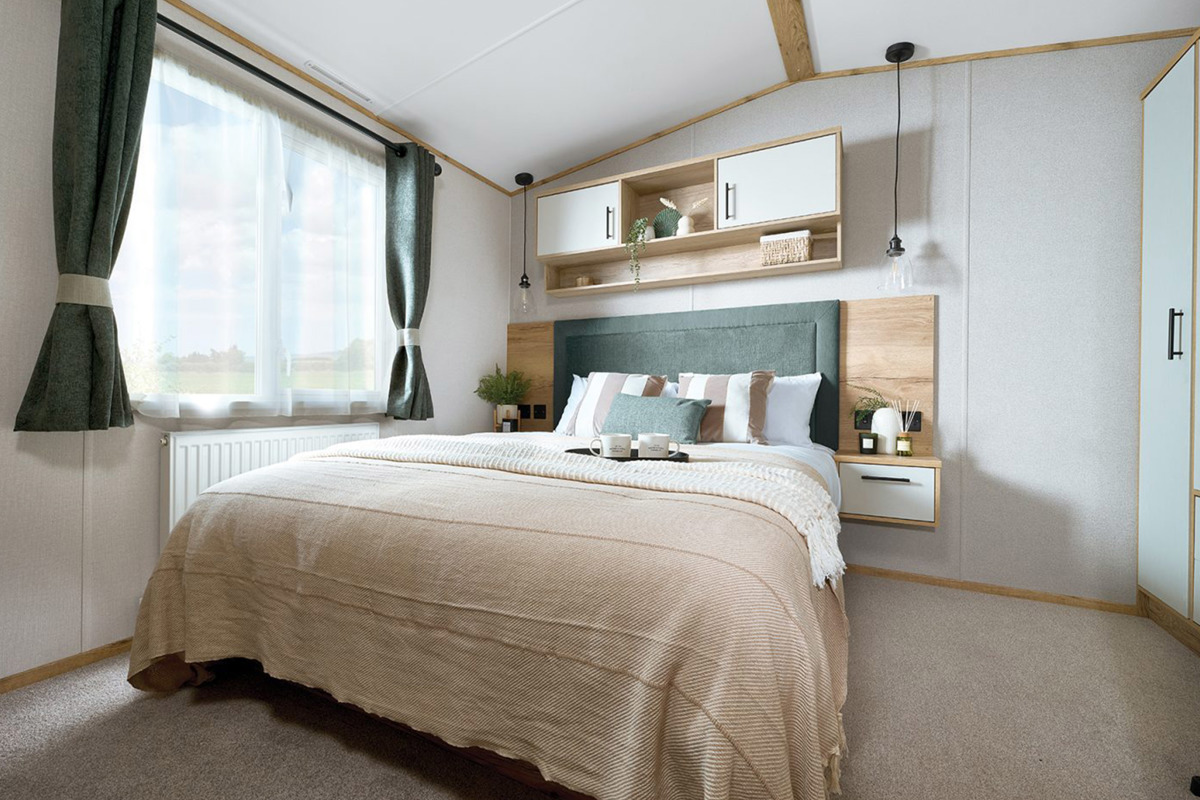 ABI St David, double bedroom with green curtains at Praa Sands
