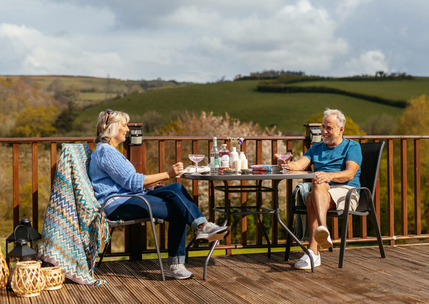 Devon Hills Couple Sat Opposite Each Other With View