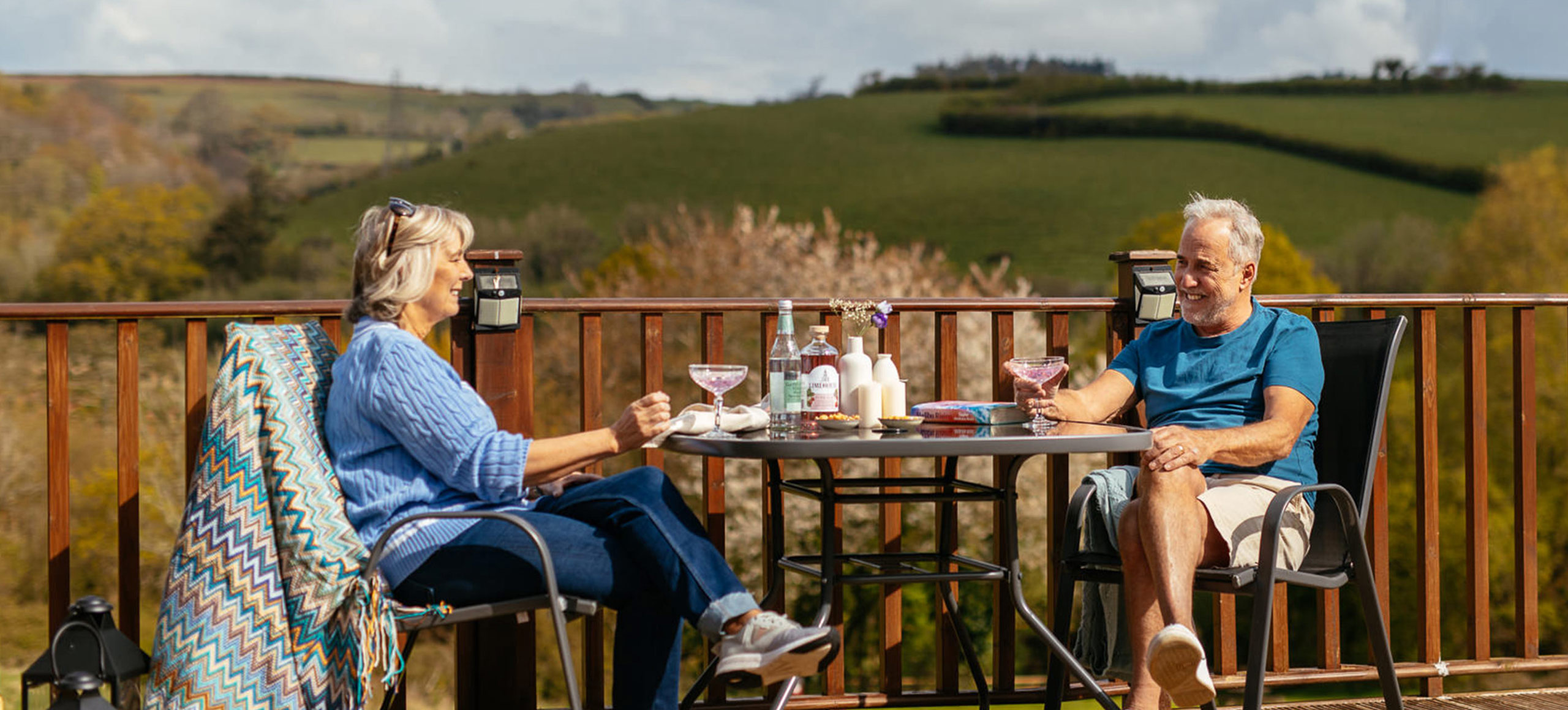 Devon Hills Couple Sat Opposite Each Other With View