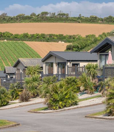 Praa Sands Overview Row Of Lodges In Front Of Fields