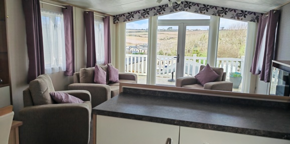 Carnaby Cascade Panoramic, living area with patio doors at Praa Sands