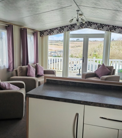 Carnaby Cascade Panoramic, living area with patio doors at Praa Sands