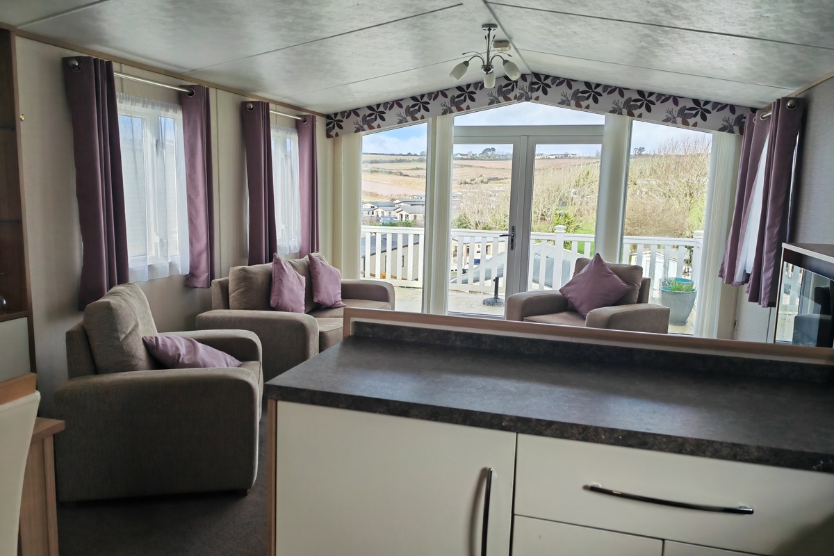 Carnaby Cascade Panoramic, living area with patio doors at Praa Sands