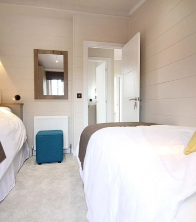 Omar Boutique, twin bedroom with mirror at Delamere