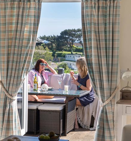 Praa Sands Friends Chatting On Patio