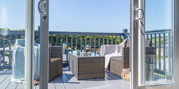 ABI St David, patio doors onto decking area at Praa Sands