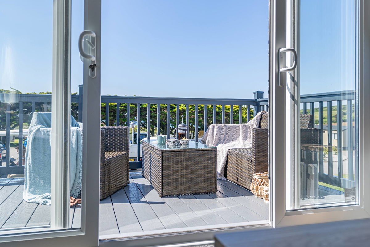 ABI St David, patio doors onto decking area at Praa Sands