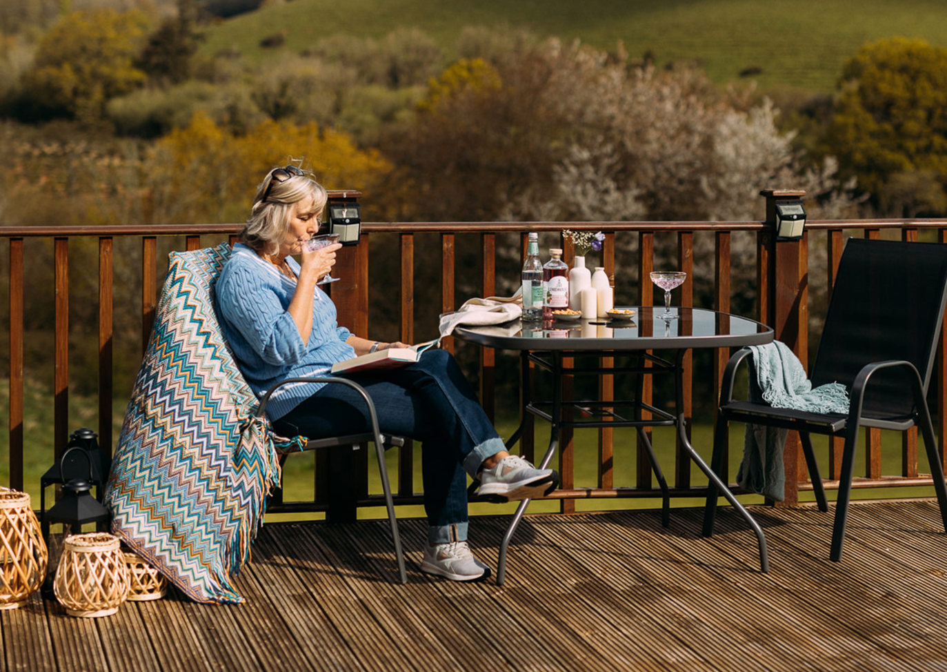 Devon Hills Lady Sipping Her Tea on Lodge Decking