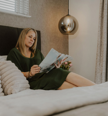 The Warren Lady Laying On The Bed