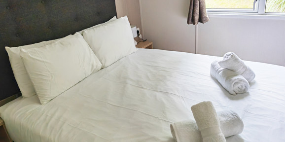 Carnaby Ashdale, double bed in master bedroom at Praa Sands