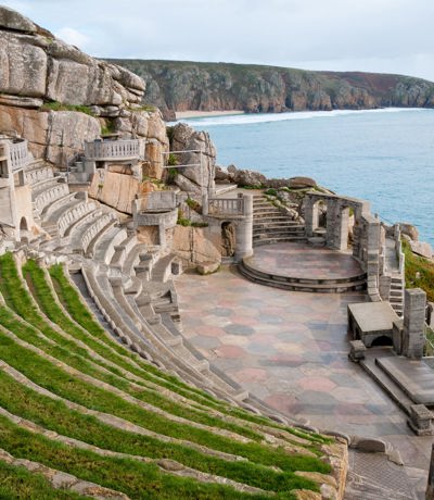 Iconic Minack Theatre carved into cliffs overlooking the ocean near Praa Sand Holiday Park.
