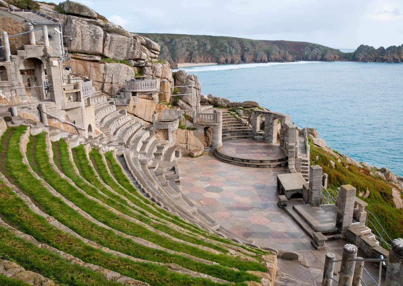 Iconic Minack Theatre carved into cliffs overlooking the ocean near Praa Sand Holiday Park.