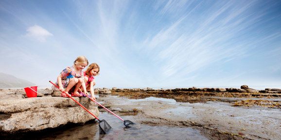 Little girls catching crabs in the sear near Finlake Resort and Spa